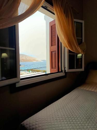 Giường trong phòng chung tại Villa Kalymnos Sea View