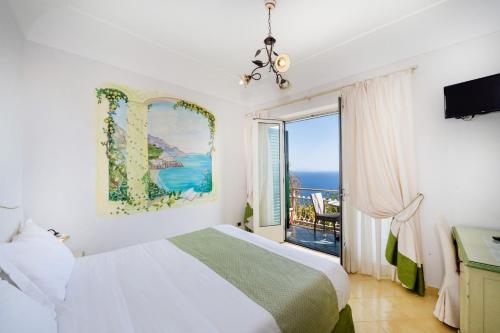 Postel nebo postele na pokoji v ubytování Locanda Degli Agrumi