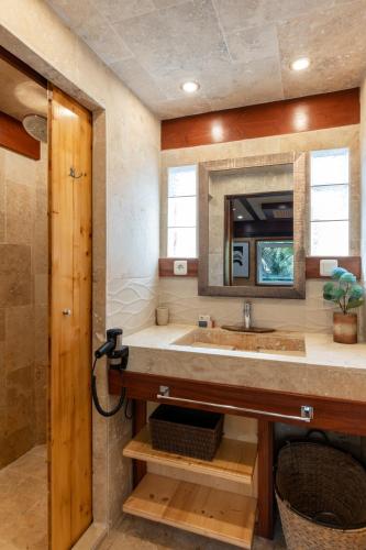a bathroom with a sink and a mirror at Toison D'or in Saint-Tropez