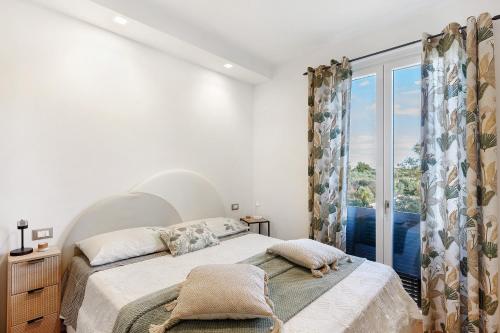 Ένα ή περισσότερα κρεβάτια σε δωμάτιο στο Lo Stralisco