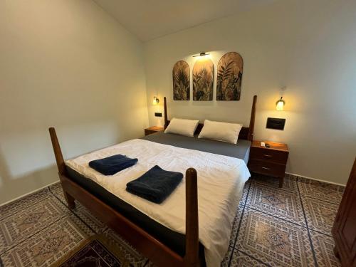 Ένα ή περισσότερα κρεβάτια σε δωμάτιο στο BRAMHA COTTAGES