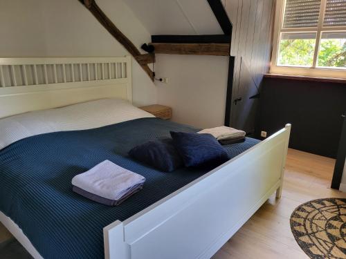 Ένα ή περισσότερα κρεβάτια σε δωμάτιο στο 't Kesselke