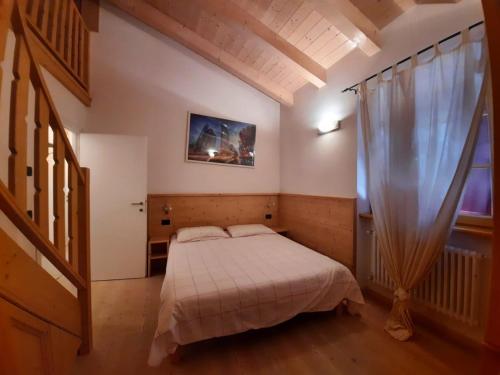 Ένα ή περισσότερα κρεβάτια σε δωμάτιο στο Appartamento la Fontana