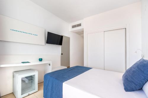 Ένα ή περισσότερα κρεβάτια σε δωμάτιο στο Hotel Vibra Algarb