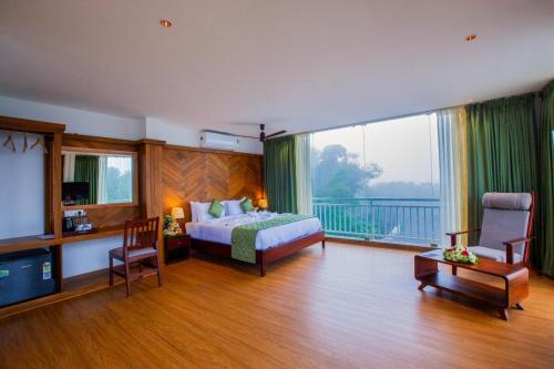 En eller flere senge i et værelse på Cardamom Village Hill Resort by EGH