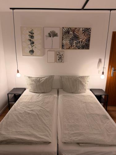 En eller flere senge i et værelse på Saniertes Apartment für Paare und Geschäftsreisende in Recklinghausen Röllinghausen