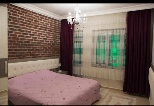 Ένα ή περισσότερα κρεβάτια σε δωμάτιο στο Muhterem Hanım Konağı