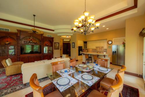 a kitchen and living room with a table and chairs at Bella Vista 8B 3 bedr 3 1 and half bath in Jacó
