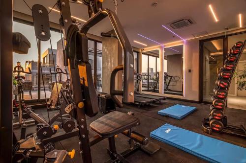 a gym with a bunch of equipment in a room at Zuba IV in Luque