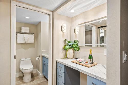 a bathroom with a toilet and a sink at Mahana 1202 · MA 1202 OceanFront Penthouse Studio in Kaanapali in Kahana