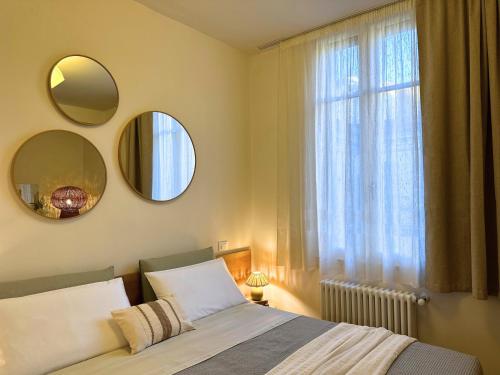 En eller flere senge i et værelse på Piazza Savoia Apartment