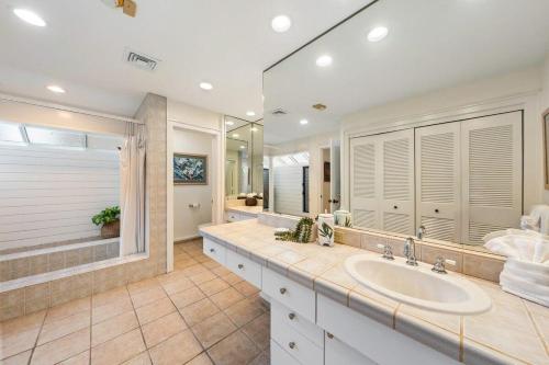 a bathroom with a sink and a large mirror at Kapalua Bay Villas 32B4 · KBV 32B4 Oceanfront Kapalua Spectacula in Kahana