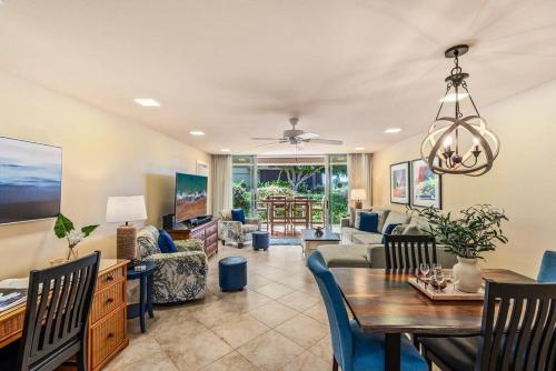 a dining room and living room with a dining table at Eldorado E102 · EL E102 Quiet Condo w Lanai AC Beach Cabana Gym in Kaanapali