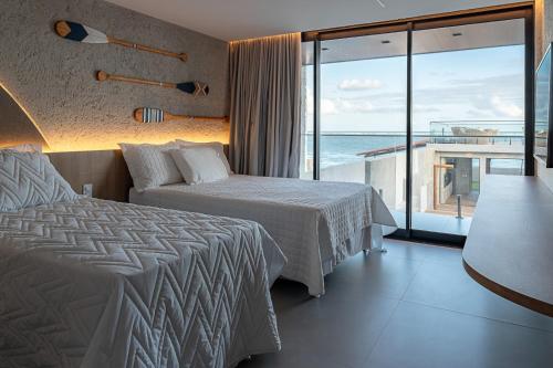 Postel nebo postele na pokoji v ubytování Casa de praia pé na areia, alto padrão, 07 quartos