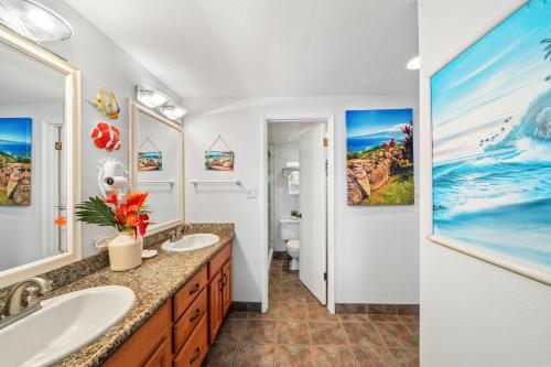 a bathroom with two sinks and a toilet at Napili Point C22 · NP C22 Oceanfront Views from 2BD West Maui Co in Lahaina
