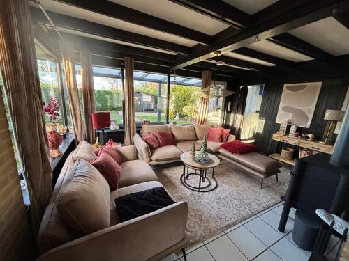 Гостиная зона в Moderner gepflegter Nr 142 ruhiger Bungalow, Strandnah mit großen, uneinsehbaren Garten, Terrassenüberdachung