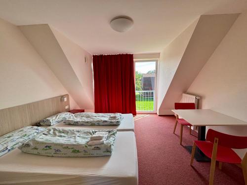 Ένα ή περισσότερα κρεβάτια σε δωμάτιο στο AS Feriendorf