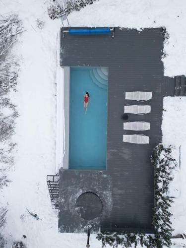 an overhead view of a blue door in the snow at Rest Hub in Slavske