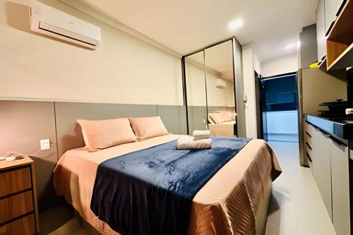 Ένα ή περισσότερα κρεβάτια σε δωμάτιο στο Studio Ágape- Equilíbrio e localização.