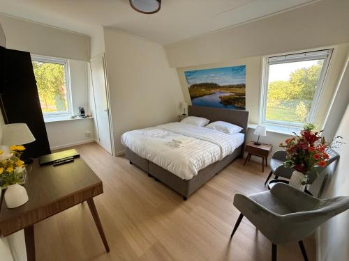 Ένα ή περισσότερα κρεβάτια σε δωμάτιο στο Herberg van Loon