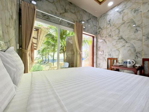 Postel nebo postele na pokoji v ubytování Nguyệt MInh 2 hotel Phan Thiet