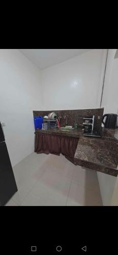 a stone bench in the middle of a room at Janice Place 2 in Marilao