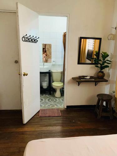a bathroom with a toilet and a sink at Anton and Isabel Bangued- 2BR for 5 in Bangued