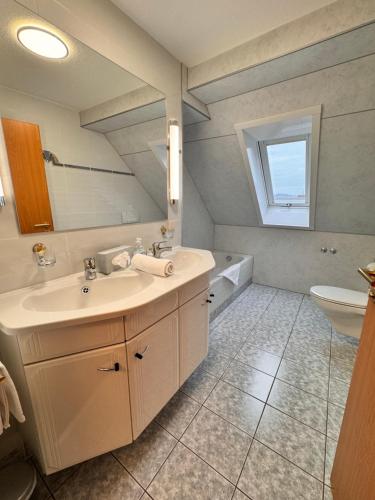 a bathroom with a sink and a toilet at Hotel Garni Eschenbach in Hildburghausen