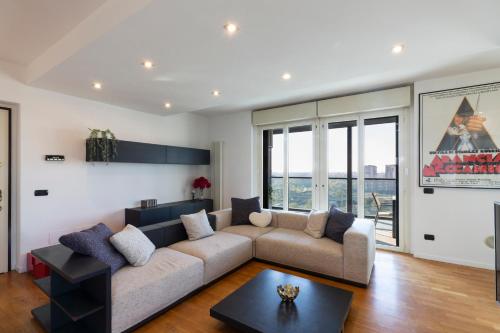 a living room with a couch and a table at Settimo Cielo - San Cristoforo in Milan