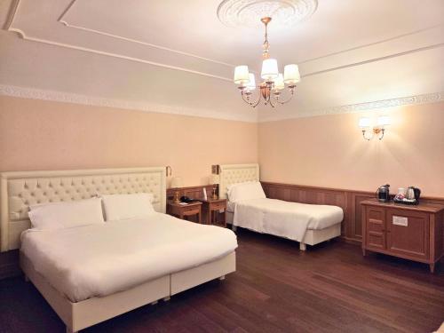 Ένα ή περισσότερα κρεβάτια σε δωμάτιο στο Phi Hotel Principe