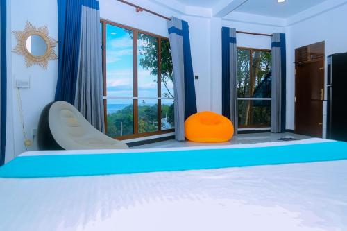 a bedroom with a bed and a large window at Cozy 1BR Villa in Weligama Panoramic Sea View in Weligama