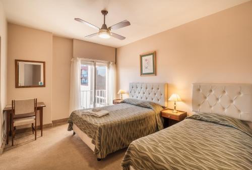 Ένα ή περισσότερα κρεβάτια σε δωμάτιο στο Hotel Marydor