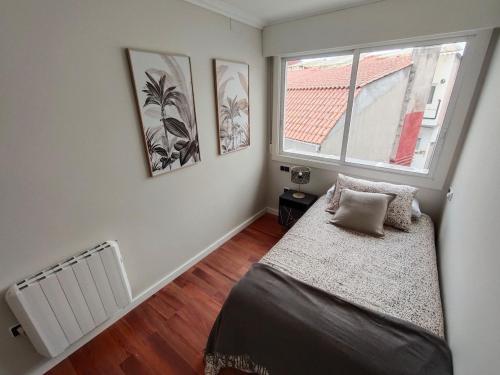 En eller flere senge i et værelse på Apartamento céntrico en Vigo