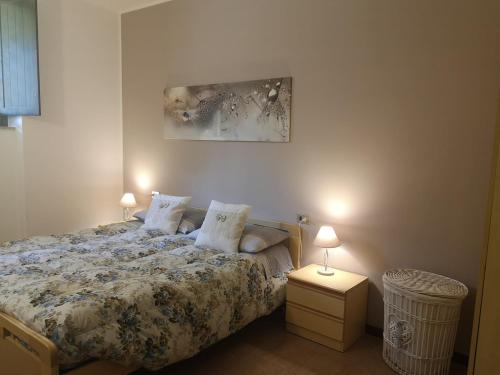 En eller flere senge i et værelse på Casa vacanze ORCHIDEA BIANCA