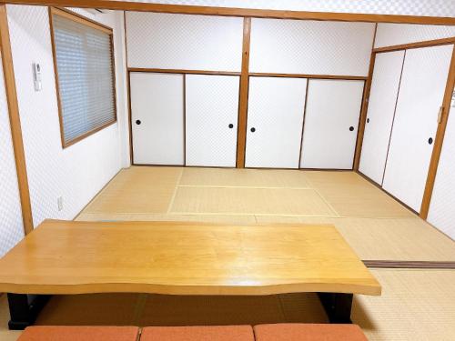 a room with white cabinets and a wooden table at Cate no mori - Vacation STAY 30749v in Shime