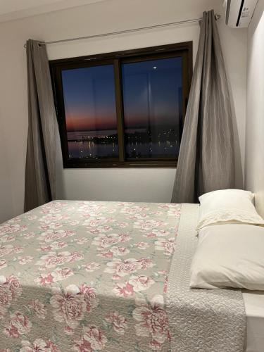 เตียงในห้องที่ Encanto del rio