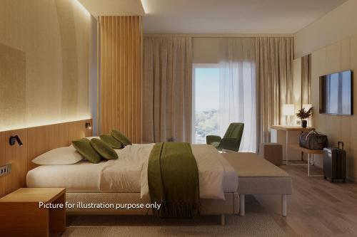 a hotel room with a bed and a window at Hotel Garden Istra Plava Laguna in Umag