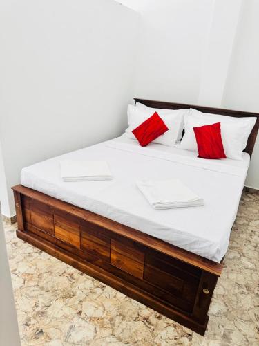 Giường trong phòng chung tại Sanju Villa