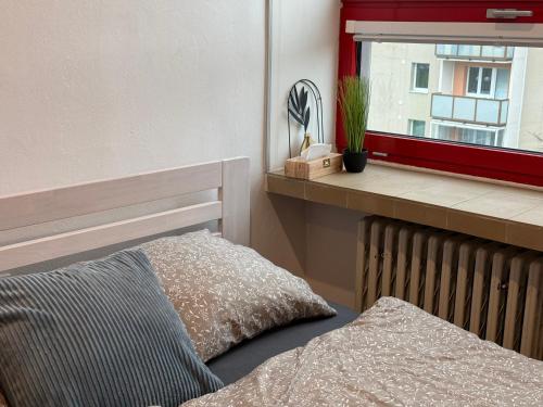 Giường trong phòng chung tại Apartmán v centre Dubnice nad Váhom