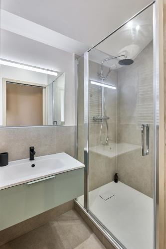 a bathroom with a shower and a sink at La Maison Générale in Besançon