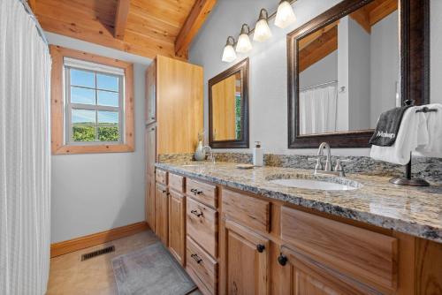 a bathroom with a sink and a mirror at Vista View in Sugar Grove