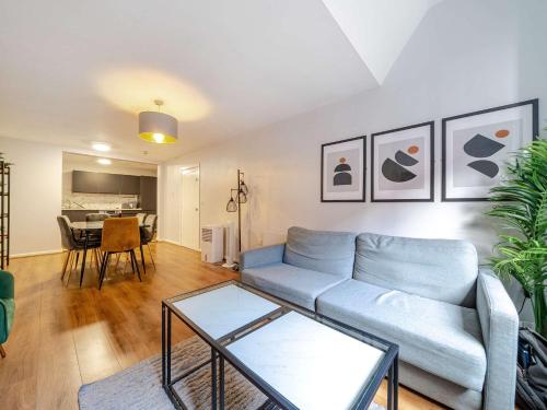 a living room with a couch and a table at Host & Stay - Stanley Street Apartments in Liverpool