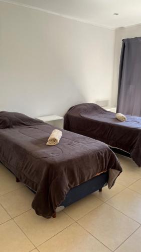 En eller flere senge i et værelse på Cabañas Vista Andes IV