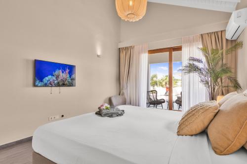 Ένα ή περισσότερα κρεβάτια σε δωμάτιο στο Villa Sol Paraiso