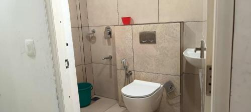 a bathroom with a toilet and a sink at Heavenly monsoon villa in Devikolam