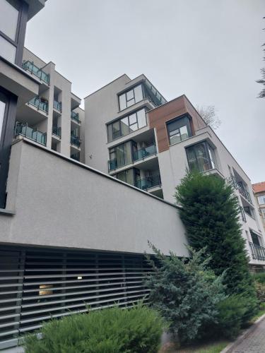 an apartment building with a large building at Elegant Urban Retreat - City Center in Arad