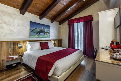 Postel nebo postele na pokoji v ubytování Hotel & Restaurant Le Charaban