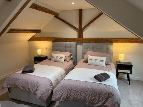 Ένα ή περισσότερα κρεβάτια σε δωμάτιο στο The Stables