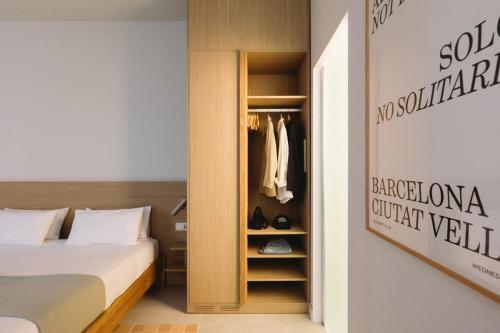 Postel nebo postele na pokoji v ubytování Outsite Barcelona