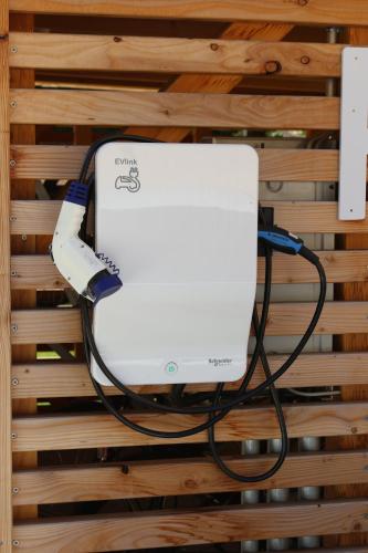 a white router with a cord plugged into a wall at Hotel Via Regia - VIAs-Hotels in Görlitz